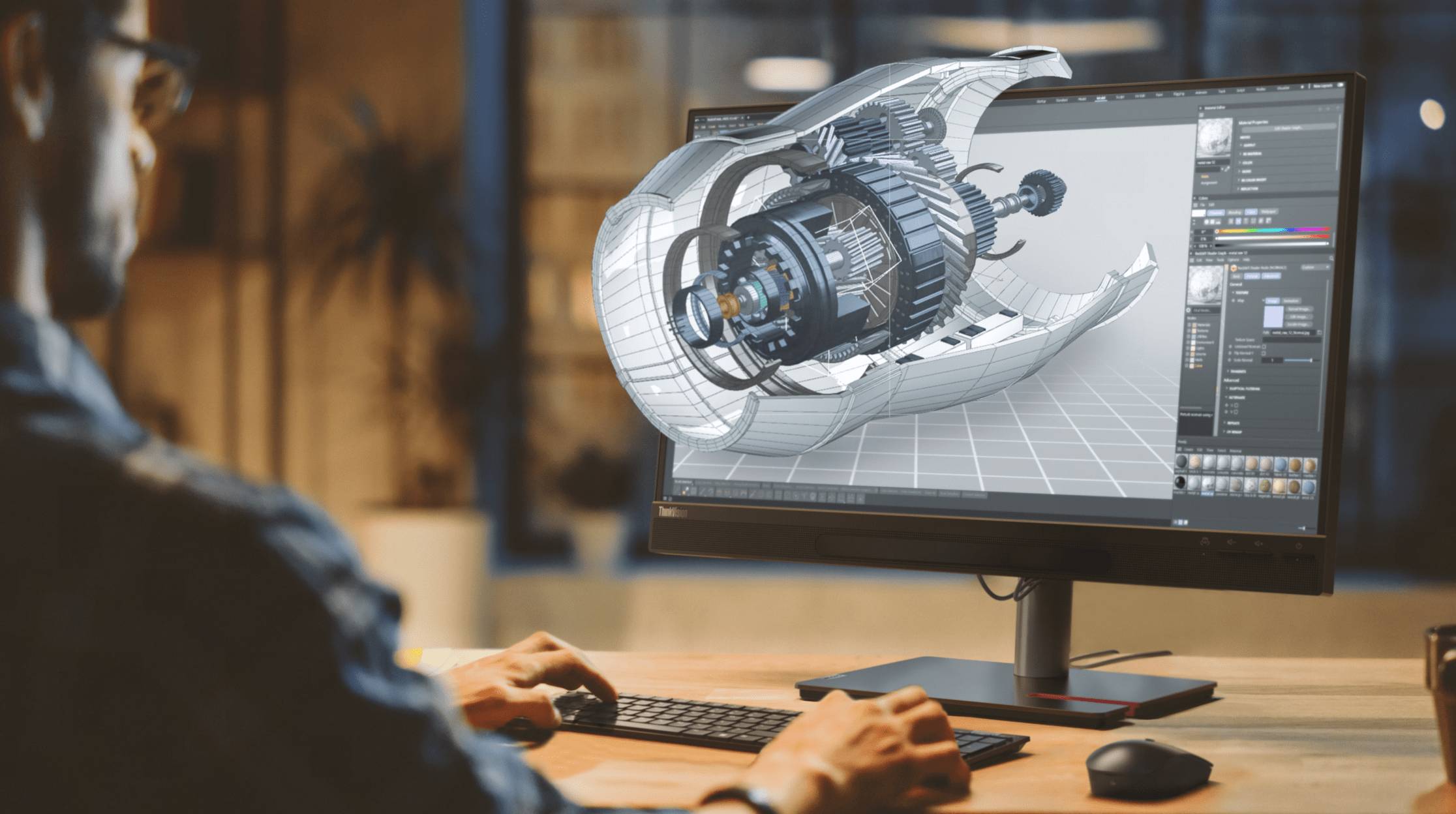 Man at computer making 3D drawings
